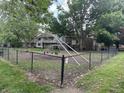 Community playground with swings and climbing structures, perfect for outdoor fun and Gathering activities at 8021 E 20Th St, Indianapolis, IN 46219