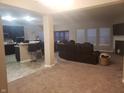 Open concept living room, kitchen, and breakfast bar at 9149 Thames Dr, Avon, IN 46123