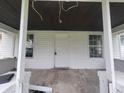 Front porch with white painted walls and concrete flooring at 1445 W 34Th St, Indianapolis, IN 46208