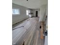 Living room with new wood-look flooring and gray walls at 1445 W 34Th St, Indianapolis, IN 46208