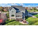 Two-story home with backyard patio and screened porch at 16845 Downstream Dr, Westfield, IN 46062