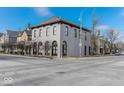 Exterior view of the building featuring architectural details, arched windows, and adjacent street at 304 N College Ave # Apt B, Indianapolis, IN 46202