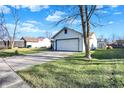 Detached garage with large yard and driveway at 4193 Sycamore Ct, Franklin, IN 46131