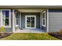 Private patio with sliding glass doors leading from the home at 4602 White Willow Way, New Palestine, IN 46163