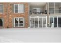 Building exterior showcasing a patio and snowy ground at 5038 Allisonville Rd # A, Indianapolis, IN 46205