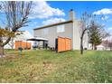 Spacious backyard with patio, gazebo, and wood privacy fence at 5340 Thompson Park Blvd, Indianapolis, IN 46237