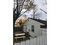 Back of house with deck and picnic table at 5473 E 19Th St, Indianapolis, IN 46218