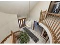 Top-down view of a grand entryway with a curved staircase at 7425 Cherryhill Dr, Indianapolis, IN 46254