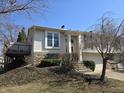 Well-maintained home featuring a deck and an inviting entrance at 7629 Farm View W Cir, Indianapolis, IN 46256