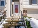 Red front door with white frame and black metal railings at 7629 Farm View W Cir, Indianapolis, IN 46256