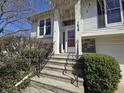 Close-up of the front entrance with stairs and a well-manicured lawn at 7629 Farm View W Cir, Indianapolis, IN 46256