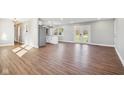 Open concept dining area with hardwood floors and French doors leading to the backyard at 901 N 700 W, Greenfield, IN 46140