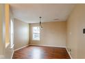 Simple dining room with hardwood floors and a light-colored wall at 2716 Redland Ln, Indianapolis, IN 46217