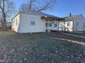 Quaint bungalow-style home with a covered porch and nice lawn at 3305 E 30Th St, Indianapolis, IN 46218