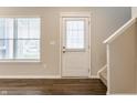 Front entry with white door, wood flooring, and blinds on the windows at 3627 Thomas Jefferson St, Westfield, IN 46074