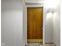 Simple apartment entry with wood door and light walls at 4000 N Meridian St # 3A, Indianapolis, IN 46208