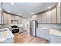 Spacious kitchen featuring modern cabinets, stainless steel appliances, and beautiful granite countertops at 4014 N Capitol Ave, Indianapolis, IN 46208