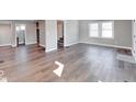 Open-concept living room with hardwood floors and neutral color palette, perfect for entertaining guests at 4014 N Capitol Ave, Indianapolis, IN 46208