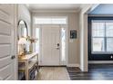 Bright and spacious entryway with a console table and mirror at 4049 Forbes Rd, Bargersville, IN 46106