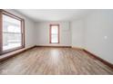 Spacious living room with hardwood floors and large windows at 503 S Harrison St, Alexandria, IN 46001