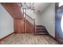 Grand wooden staircase with ornate detailing in the entryway at 503 S Harrison St, Alexandria, IN 46001