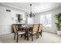 Elegant dining room with chandelier and hardwood table at 7488 River Highlands Dr, Fishers, IN 46038