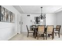Formal dining room featuring a chandelier and six chairs at 7488 River Highlands Dr, Fishers, IN 46038