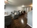 Open living room and dining area with hardwood floors at 759 Harvest Meadow Way, Whiteland, IN 46184