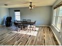 Spacious dining area with wood-look floors, and a large window at 9486 W Midnight Dr, Pendleton, IN 46064