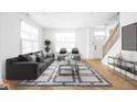 Spacious living room featuring hardwood floors and ample natural light at 1003 Alabama St, Indianapolis, IN 46202
