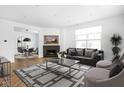 Bright living room with hardwood floors, fireplace, and stylish furniture at 1003 Alabama St, Indianapolis, IN 46202