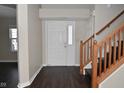Front entry with staircase and dark hardwood floors at 11369 Pegasus Dr, Noblesville, IN 46060