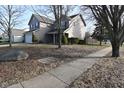 Landscaped yard with large stone and sidewalk at 11369 Pegasus Dr, Noblesville, IN 46060
