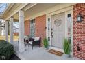 Cozy covered porch featuring comfortable seating, potted plants, and a welcoming entrance to the home at 18822 Gusset Ct, Noblesville, IN 46062