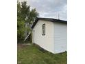 White vinyl siding with black window frames on the side of the house at 2722 Collier St, Indianapolis, IN 46241