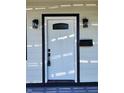 White front door with black frame and glass panel at 3156 Graceland Ave, Indianapolis, IN 46208