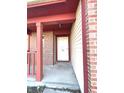 Front entrance with red columns and white door at 621 Meadows Edge Ln, Indianapolis, IN 46217