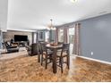 Dining area with a wooden table and chairs, near the kitchen at 6232 Emerald Springs Dr, Indianapolis, IN 46221