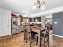 Kitchen with stainless steel appliances and a breakfast bar at 6232 Emerald Springs Dr, Indianapolis, IN 46221