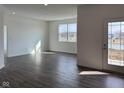 Bright and airy living room with an exterior door offering lots of natural light at 885 Saddlebrook Farms Blvd, Whiteland, IN 46184