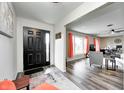 Bright entryway with hardwood floors and view into living room at 89 Hillview Dr, Martinsville, IN 46151