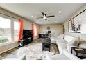 Spacious living room with large TV, hardwood floors, and comfy seating at 89 Hillview Dr, Martinsville, IN 46151