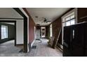 Hallway with red walls and exposed staircase at 139 S Jefferson St, Martinsville, IN 46151