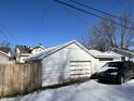 One car detached garage with wooden door at 1709 W 11Th St, Muncie, IN 47302