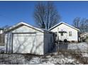 Detached garage with snowy yard at 1717 W 11Th St, Muncie, IN 47302