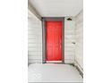 Bright red front door entrance with gray trim at 1819 Southeastern Ave, Indianapolis, IN 46201