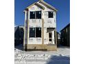 New construction home exterior; two-story home, covered porch, winter scene at 2021 Cornell Ave, Indianapolis, IN 46202