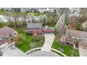 An aerial view of a neighborhood with a pond, mature trees, and well-maintained lawns at 20485 Country Pine Ct, Noblesville, IN 46062
