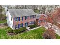 An aerial view of a two-story brick home with a three-car garage and nice landscaping at 20485 Country Pine Ct, Noblesville, IN 46062
