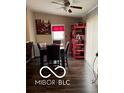 Bright dining area with dark floors and red accents at 2714 Baltimore Ave, Indianapolis, IN 46218